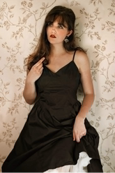 a lady in a black slip dress